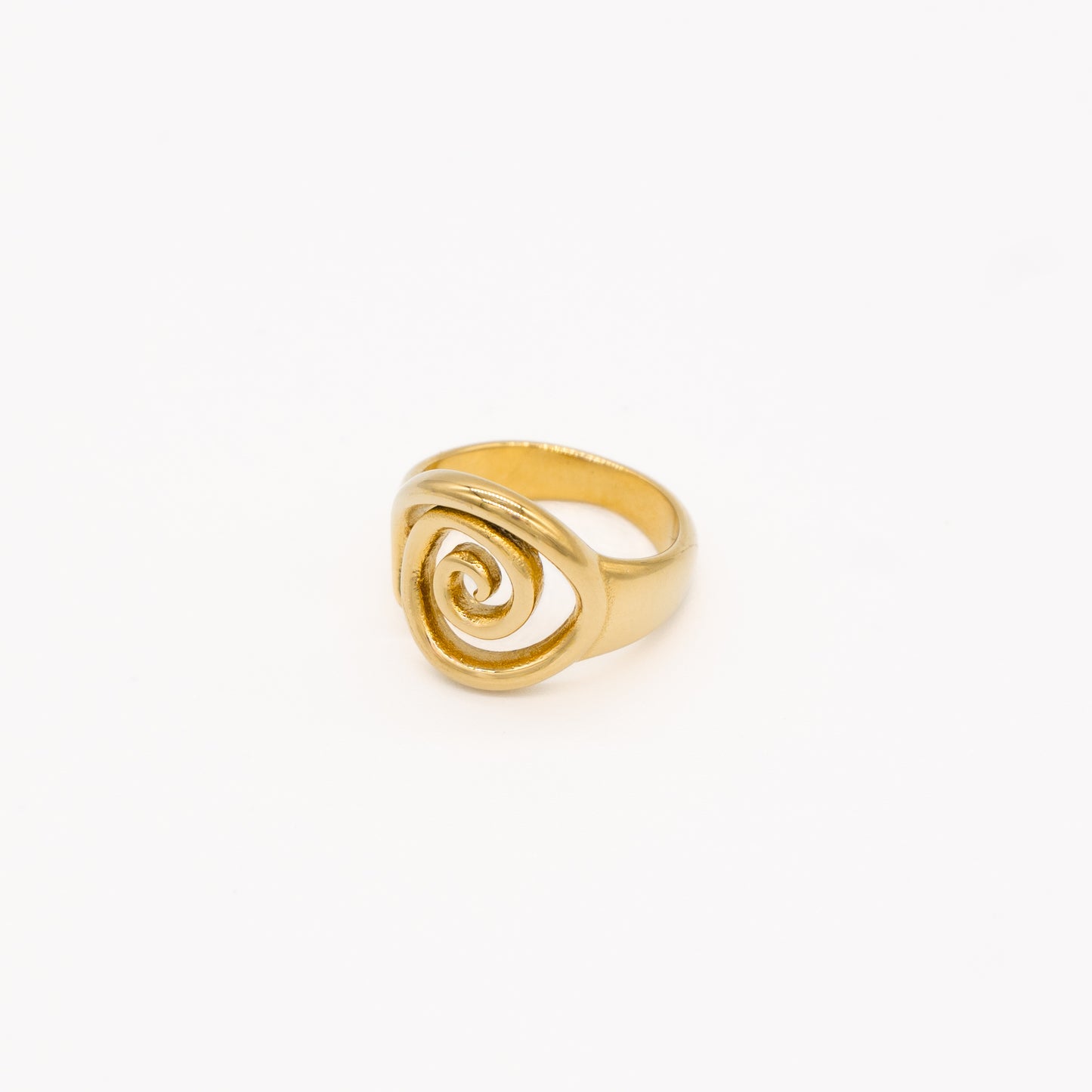 Gold ring with a spiral design on a white background