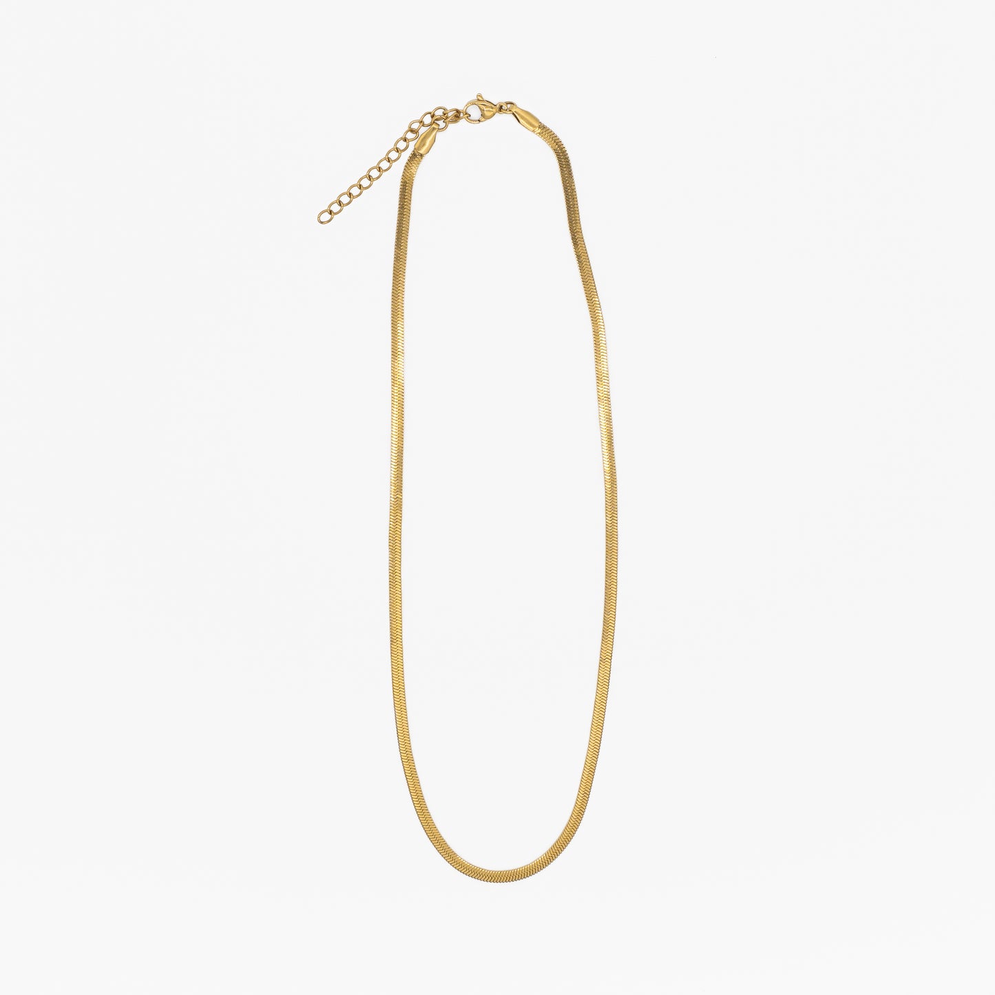 Gold "snake" necklace on a white background