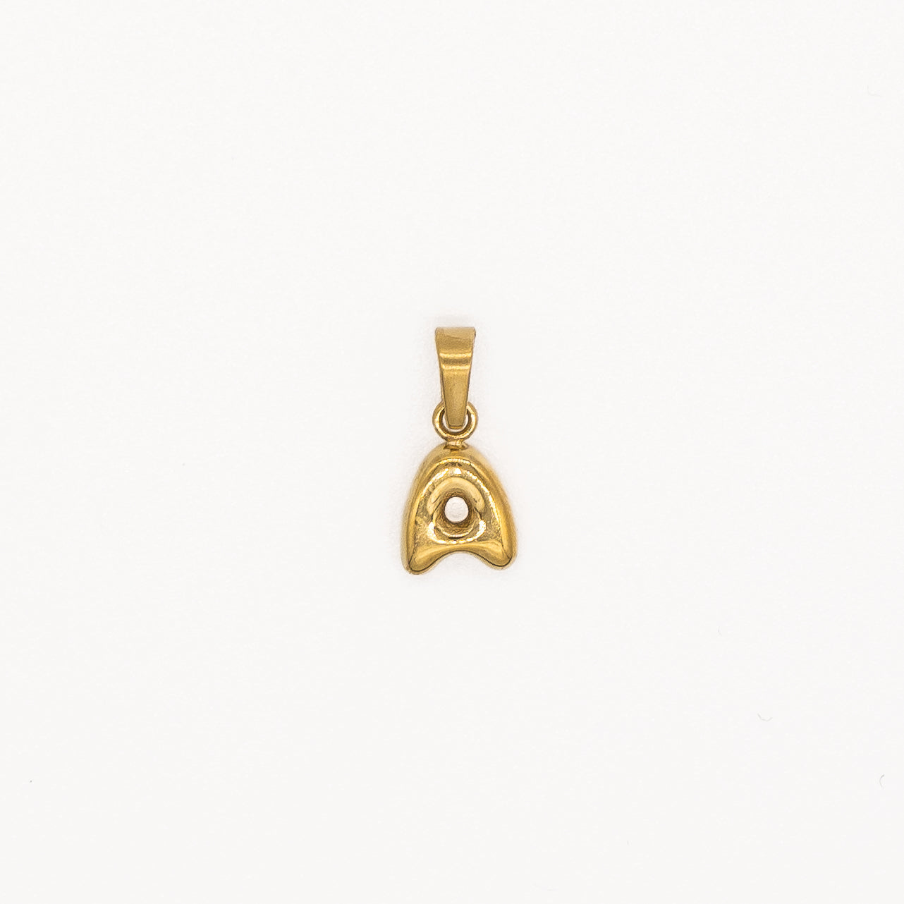 Gold pendant on a white background
