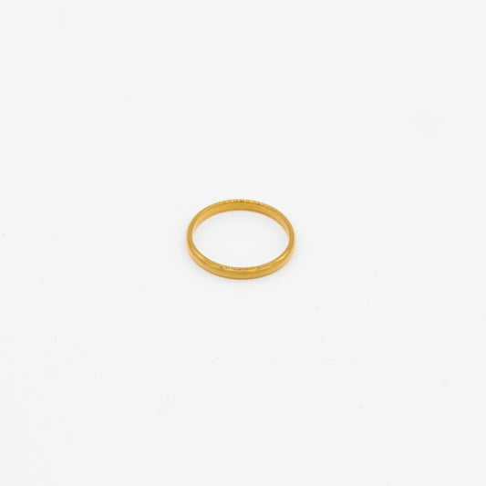 Gold simple ring on a white background