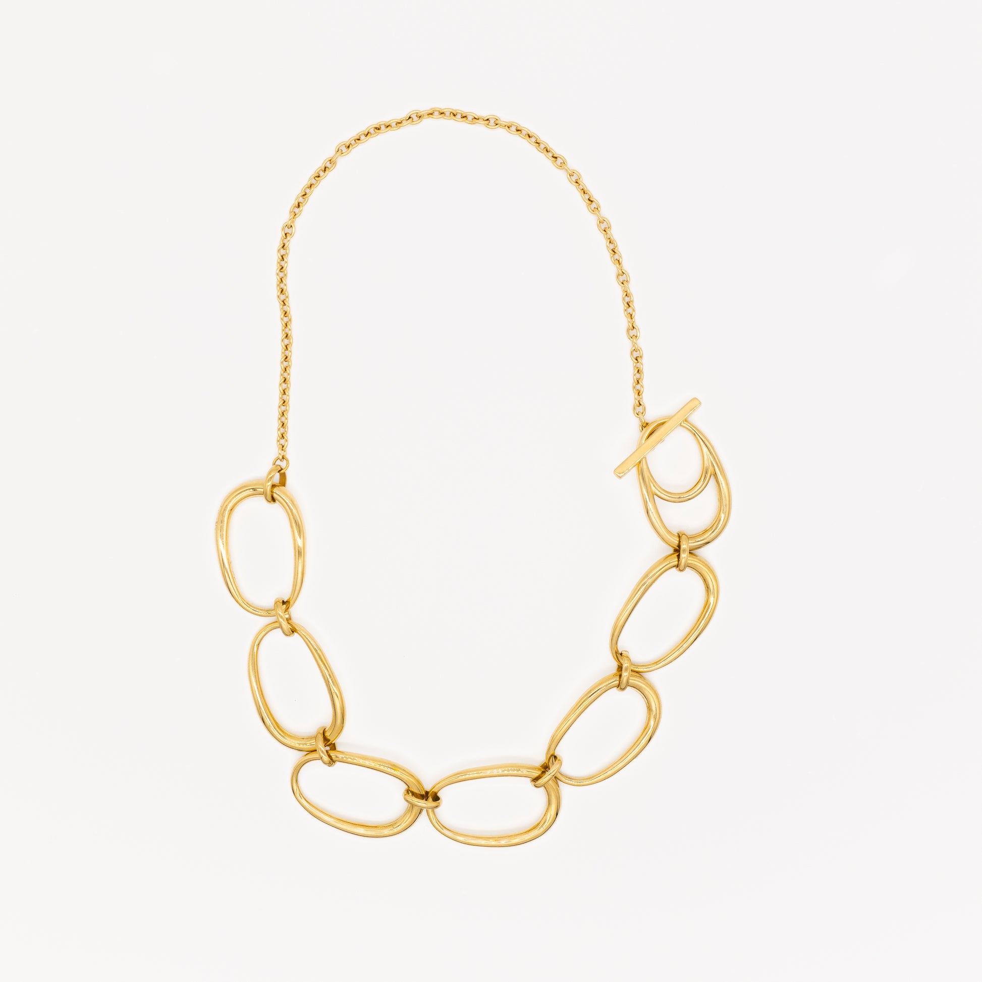 Gold chain necklace with large links on a white background